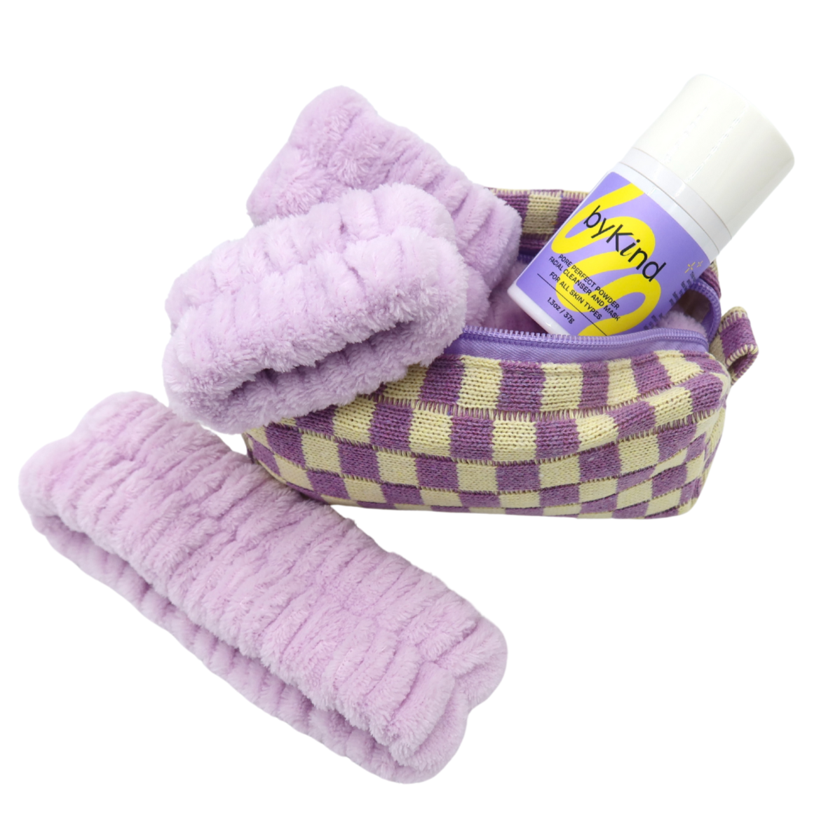 microfiber headband and wristbands with bottle of facial cleanser and a checkered toiletry bag